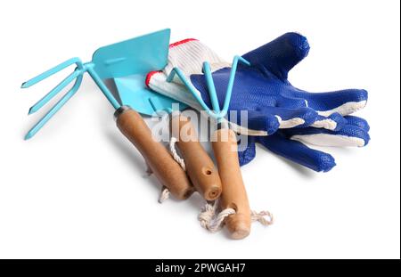 Pair of gloves and gardening tools on white background Stock Photo
