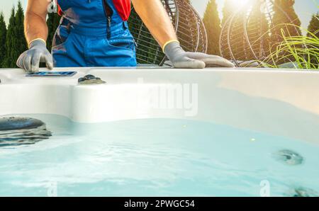 Caucasian Hot Tubs Technician Performing Residential Spa Necessary Pre Season Check Stock Photo