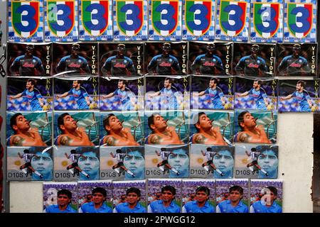 Naples, Italy. 30th Apr, 2023. Pins of Scudetto, Khvicha Kvaratskhelia, Victor Osimhen and Diego Armando Maradona for sale in Naples, Italy, on 30 April 2023. Following the combination of results from today's league day, Napoli will have to wait another day or two of matches to celebrate its third Scudetto. Credit: Insidefoto di andrea staccioli/Alamy Live News Stock Photo