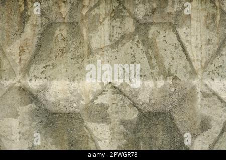Abstract texture, gray concrete fence. Concrete trapezoid paver blocks. Design geometric mosaic texture for the decoration. Embossment texture Stock Photo
