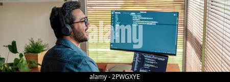 Male freelancer making new project as web designer or programmer on his computer at home office Stock Photo