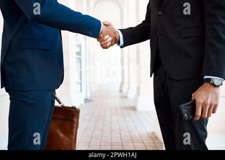 Expand the business by making partners. unrecognizable businessmen shaking hands outside. Stock Photo
