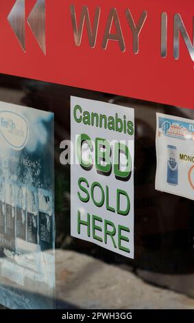 Malia, Crete, Greece, EU. 2023.  Cannabis CBD sold here sign on a supermarket shop window. Stock Photo