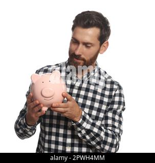 Happy man with ceramic piggy bank on white background Stock Photo - Alamy