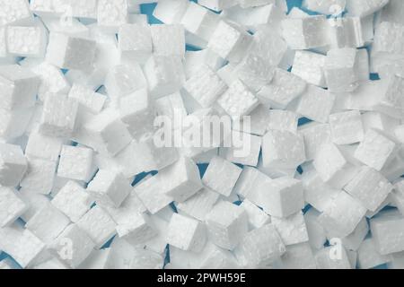 Many styrofoam cubes on light blue background, top view Stock Photo