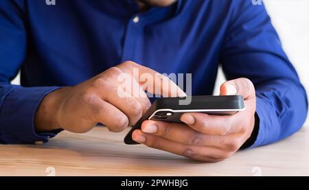Close up of a man using mobile, smartphone for searching. Social networks Concept. Stock Photo