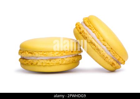 Yellow macaron cookies isolated on white background. Stock Photo