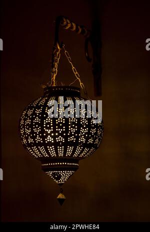 Traditional Moroccan Brass Lantern in Bedroom Stock Photo