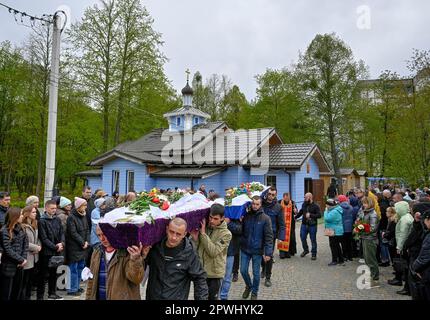 Uman, Ukraine. 30th Apr, 2023. People carry the bodies of Shulga Sofia, 11 years old, and her brother Pisarev Kiryusha, 17 years old, who died as a result of a Russian missile attack on a multi-storey residential building in Uman during the funeral ceremony. On April 28, the Russian army launched massive missile strikes on Ukraine. As a result of the shelling of the city of Uman, a rocket hit a residential building. 23 people died, including 6 children. 19 people were injured. (Photo by Sergei Chuzavkov/SOPA Images/Sipa USA) Credit: Sipa USA/Alamy Live News Stock Photo