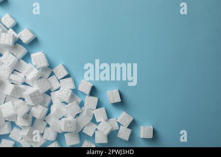 Many styrofoam cubes on light blue background, flat lay. Space for text Stock Photo