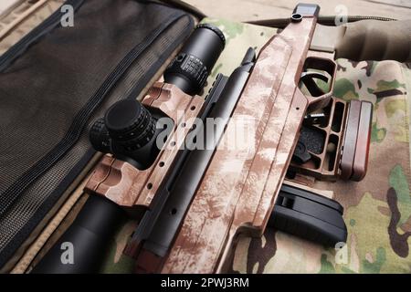 camouflaged sniper rifle with scope Stock Photo - Alamy