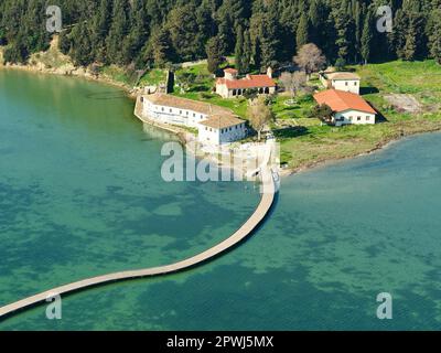 AERIAL VIEW. St-Mary Monastery on an island accessible by footbridge. Zvërnec, Vlorë County, Albania. Stock Photo