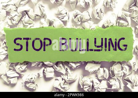 Sign displaying Stop Bullying, Word Written on Fight and Eliminate this Aggressive Unacceptable Behavior Stock Photo