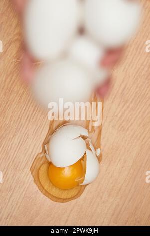 broken egg on the floor in kitchen, top view Stock Photo