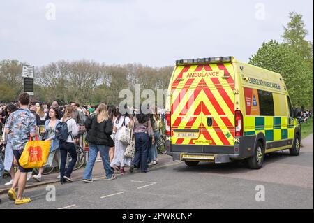 Jesus Green, Cambridge, 30th April 2023 - Emergency Services were on hand to take care of those who had partied a little too hard. -Hordes of Cambridge University students flocked to a park on Sunday afternoon in the Bank Holiday sunshine for the annual 'Caesarian Sunday' drinking party. Undergraduates from the prestigious institution frolicked through the afternoon in fancy dress taking part in drinking games on Jesus Green. The tradition, also known as ‘C-Sunday' attracts thousands of students just before they take part in exams. Police were present to keep the academics in check. Credit: Be Stock Photo