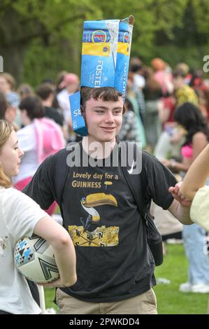 Jesus Green, Cambridge, 30th April 2023 - Hordes of Cambridge University students flocked to a park on Sunday afternoon in the Bank Holiday sunshine for the annual 'Caesarian Sunday' drinking party. Undergraduates from the prestigious institutions frolicked through the afternoon in fancy dress taking part in drinking games on Jesus Green. The tradition, also known as ‘C-Sunday' attracts thousands of students just before they take part in exams. Police were present to keep the academics in check. With some revellers needing assistance from paramedics after various mishaps. Credit: Stop Press Me Stock Photo