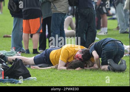 Jesus Green, Cambridge, 30th April 2023 - Hordes of Cambridge University students flocked to a park on Sunday afternoon in the Bank Holiday sunshine for the annual 'Caesarian Sunday' drinking party. Undergraduates from the prestigious institutions frolicked through the afternoon in fancy dress taking part in drinking games on Jesus Green. The tradition, also known as ‘C-Sunday' attracts thousands of students just before they take part in exams. Police were present to keep the academics in check. With some revellers needing assistance from paramedics after various mishaps. Credit: Stop Press Me Stock Photo