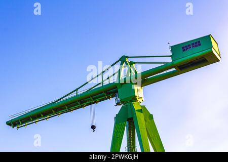 Green large ship crane container crane Rickmerswerft tower crane in Center Central South Bremerhaven Bremen Germany. Stock Photo