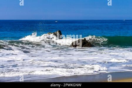 Extremely beautiful huge big surfer waves and rocks on the beach in Zicatela Puerto Escondido Oaxaca Mexico. Stock Photo