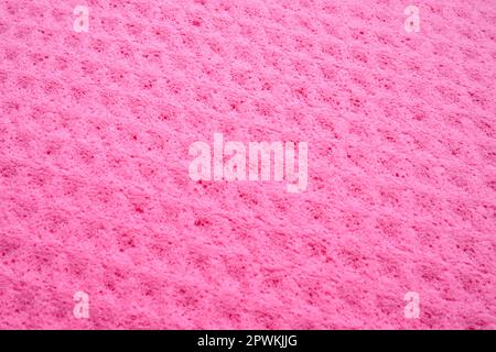 Sponge fibers sponge texture pattern surface close-up pink magenta background. Stock Photo