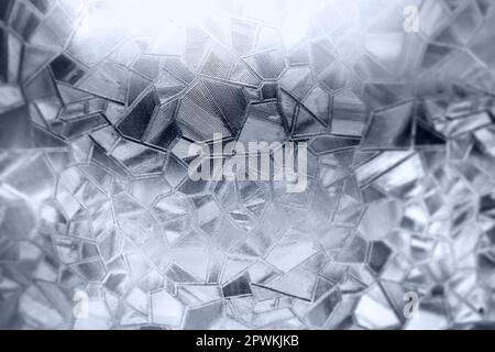 Embossed glass background. Corrugated glass monochrome. Refraction of light in a bumpy transparent surface under backlight. The play of white and gray Stock Photo