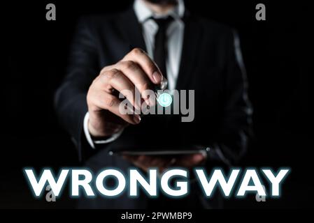 Text caption presenting Wrong Way, Business concept taking an unsuitable or undesirable manners or direction Stock Photo