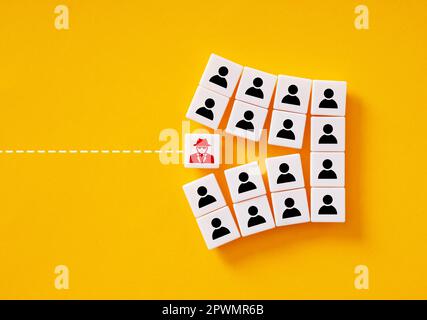 Intruder spy splits the team. Corporate and industrial espionage. Sabotage of the teamwork and corporate unity. Workplace security threat and violatio Stock Photo