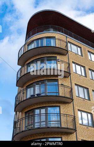 Corner house with rounded facade and windows Stock Photo - Alamy