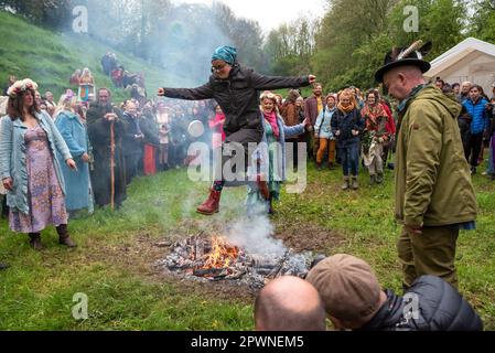 Glastonbury, UK. 1st May, 2023. Pagan Beltane Fire Ceremony and fire jumping in the Chalice Well Cress Field. Credit: Stephen Bell/Alamy Live News Stock Photo