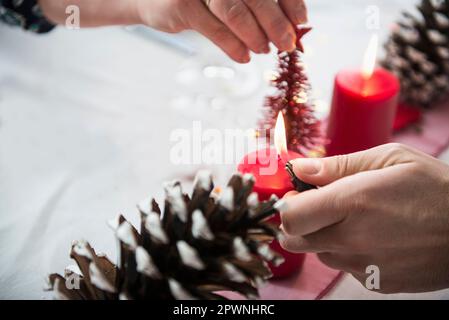 Close-up of man igniting candle Stock Photo