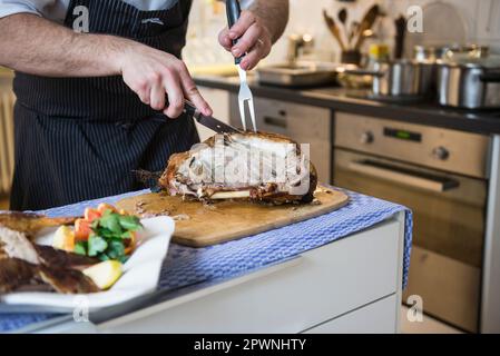 Chef carving a roasted duck Stock Photo