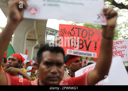 DHAKA, BANGLADESH - MAY 1: Bangladeshi garment workers and other labor organization activists participate in a rally to mark May Day or International Stock Photo