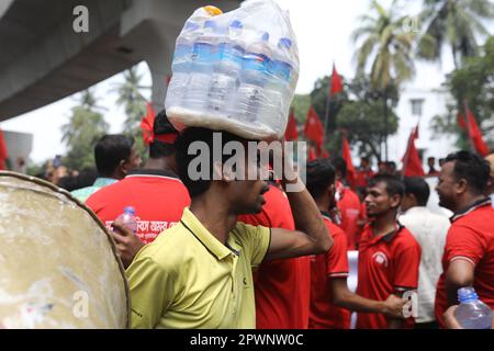DHAKA, BANGLADESH - MAY 1: Bangladeshi garment workers and other labor organization activists participate in a rally to mark May Day or International Stock Photo