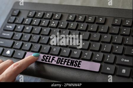 Handwriting text Self Defense, Word for the act of defending one's person when physically attacked Stock Photo