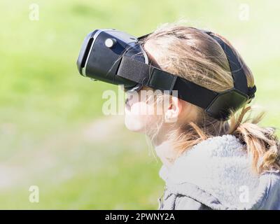 Girl using virtual reality headset Stock Photo