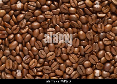 Roasted coffee beans texture or background. Close up, top view. Stock Photo