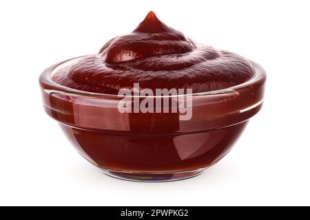 Barbecue sauce in glass transparent bowl, close-up. Isolated on white background. Stock Photo