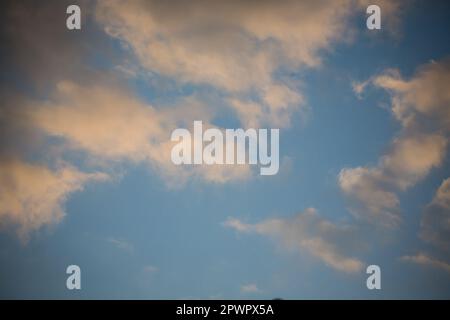 Cumulus clouds in the evening sky Stock Photo