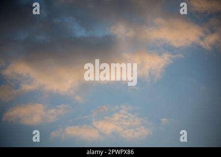 Cumulus clouds in the evening sky Stock Photo
