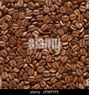 Roasted coffee beans texture or background. Close up, top view. Stock Photo