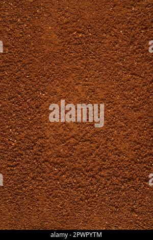 Pile of powdered ground coffee background or texture, top view. Stock Photo