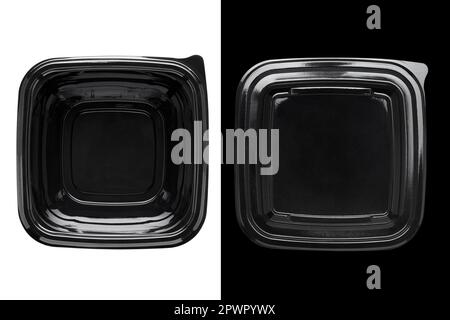 Black plastic food container with transparent lid on white and black background. Top view. Stock Photo