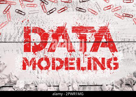 Hand writing sign Data Modeling, Business overview process of transferring data between data storage systems Stock Photo