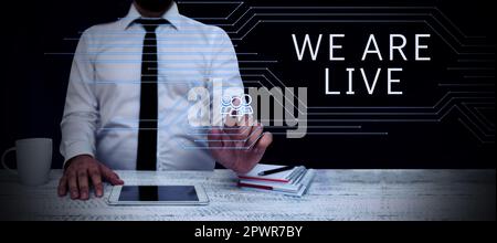 Text showing inspiration We Are Live, Word Written on continuous report or chat that is streamed in real time Stock Photo
