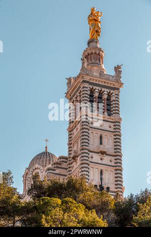 Notre-Dame de la Garde or la Bonne Mère is a Catholic basilica in Marseille, France and the city's best known symbol. Stock Photo