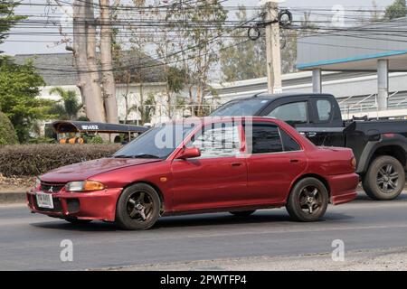 Chiangmai, Thailand -   February 28 2023: Private car, Mitsubishi Lancer.. On road no.1001, 8 km from Chiangmai Business Area. Stock Photo