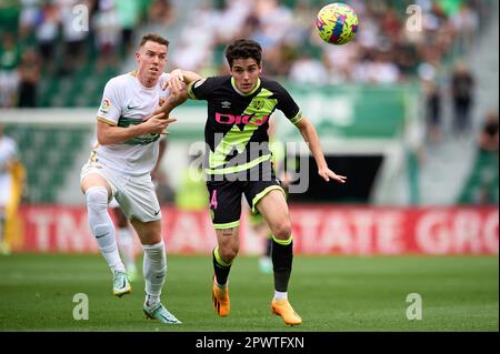 ELCHE, SPAIN - APRIL 29: Carlos Clerc of Elche CF competes for the ball with Sergio Camello of Rayo Vallecano during the LaLiga Santander match Stock Photo