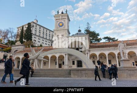 UDINE, Italy - December 8, 2022: Libertà square crowded with people and decorated with a giant comet for Christmas time Stock Photo