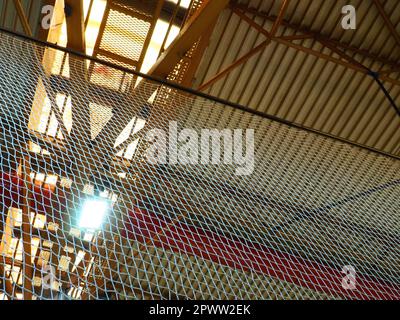 The roof of a hangar, a production hall or a sports hall. Metal structures, beams, supporting elements. Ventilation systems in large halls and rooms. Stock Photo