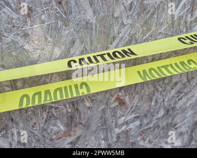 Yellow Caution Tape on Old Abandoned Building on a Rural Area Stock Photo